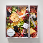 Load image into Gallery viewer, large grazing box with cheese, charcuteries, fruits, vegetables, hummus and jam - packaged
